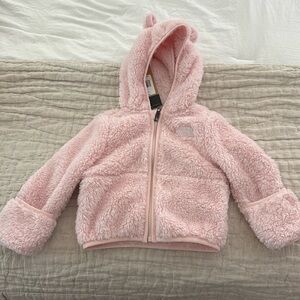 North face 6-12 months. Never worn